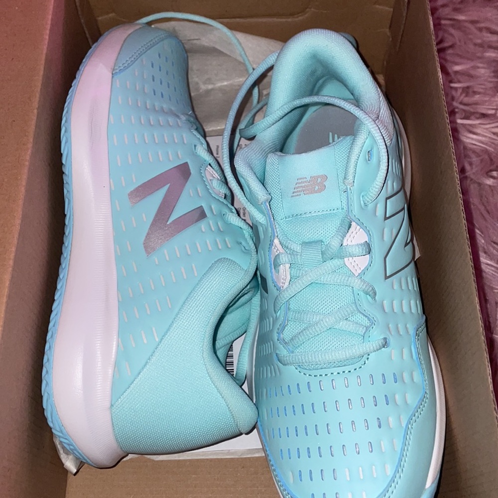 Brand new NEW BALANCE tennis/clay sneakers. Size 9